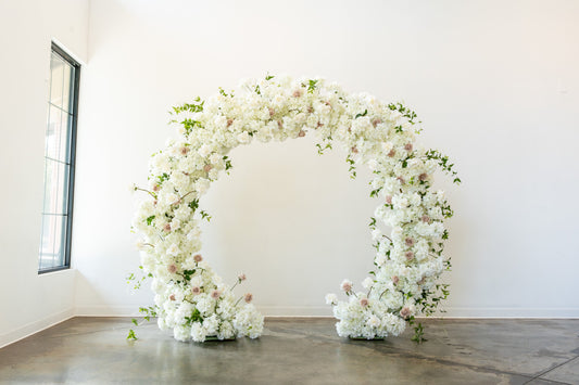 Rent the ayla circle arch which features white roses, over 500 hydrangeas, and wispy clematis greenery