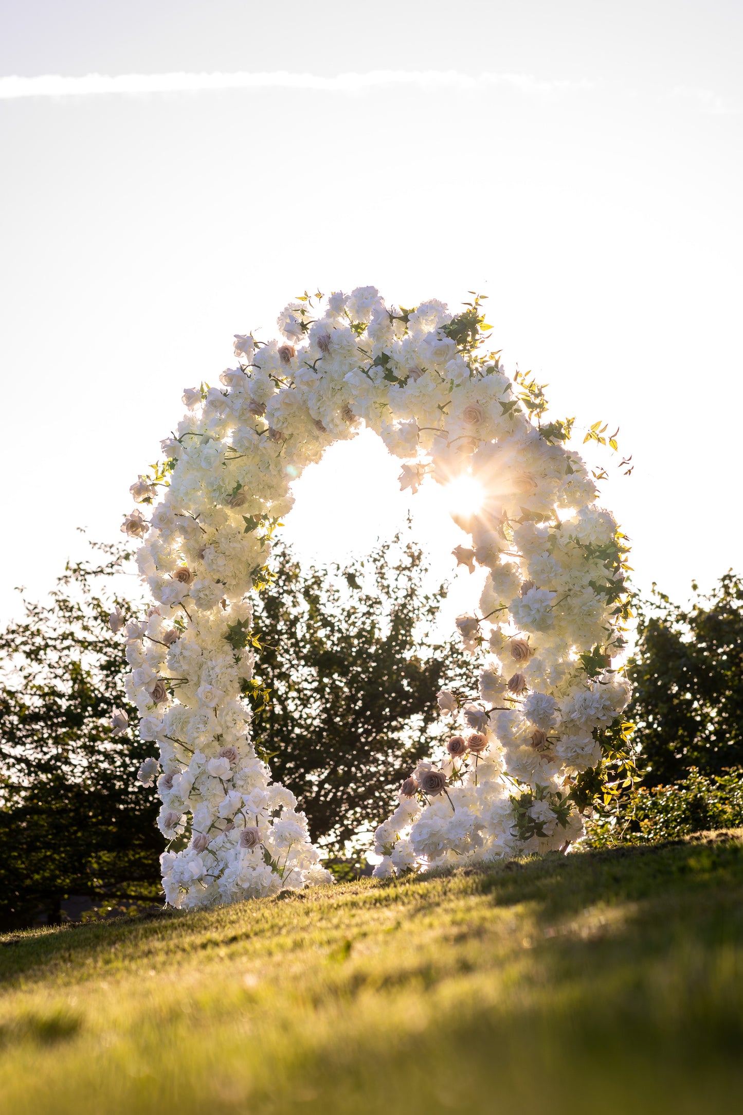 Ayla Circle Arch hitting the Pacific Northwest sunset, perfect for an evening wedding ceremony