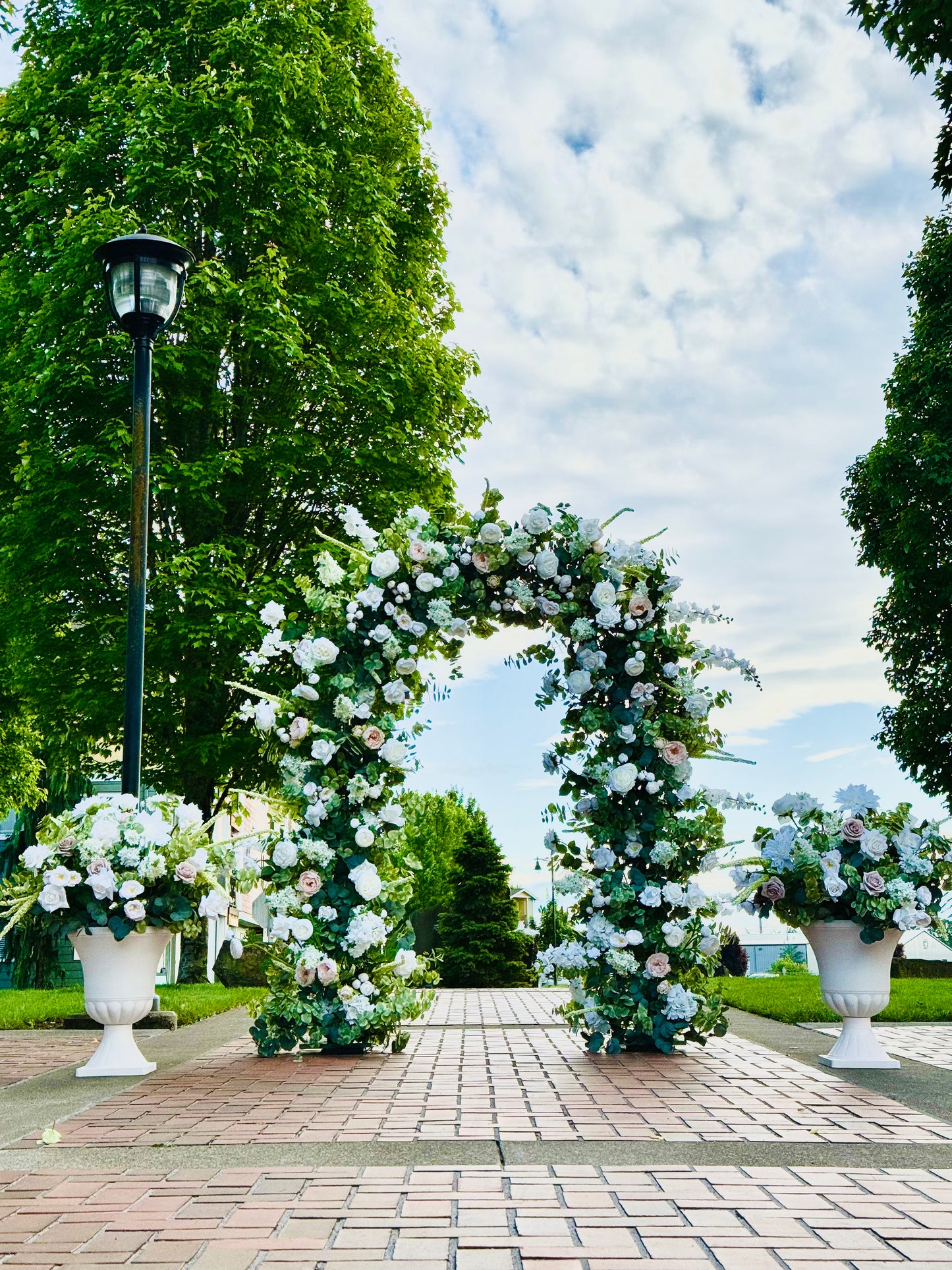 Wedding arch for rent in PDX and Vancouver, WA areas - featuring Daphne Garden Arch with lush greenery