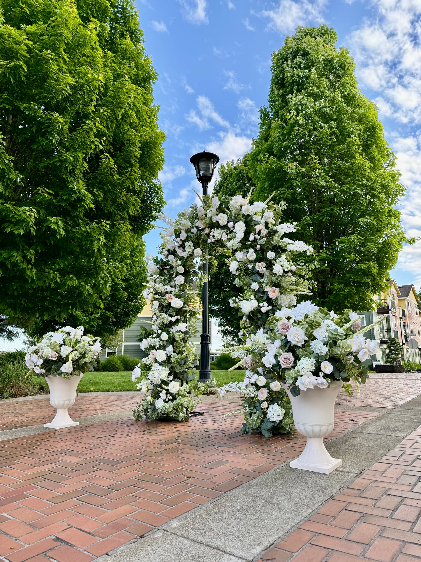 Arch for wedding using real touch silk flowers by Everlasting Arch Designs. Daphne and Sophia floral urn